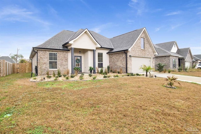 view of front of home featuring a garage and a front lawn