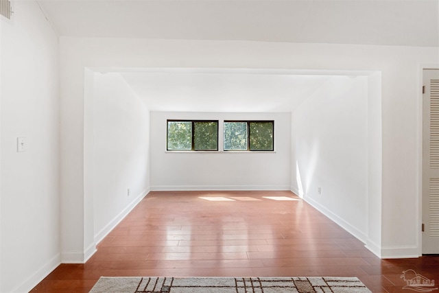 unfurnished room featuring dark hardwood / wood-style floors