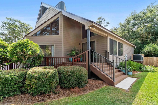 exterior space with a yard and central AC unit