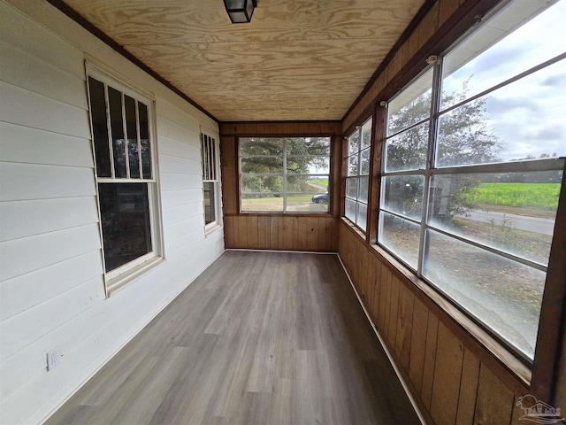 unfurnished sunroom featuring wooden ceiling