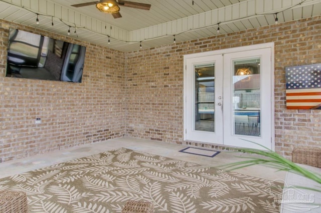 interior space featuring a ceiling fan and french doors