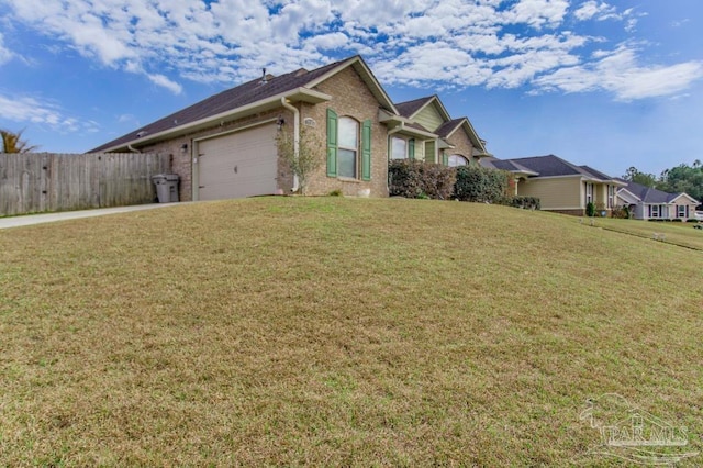 view of front of home featuring a residential view, an attached garage, fence, a front lawn, and brick siding