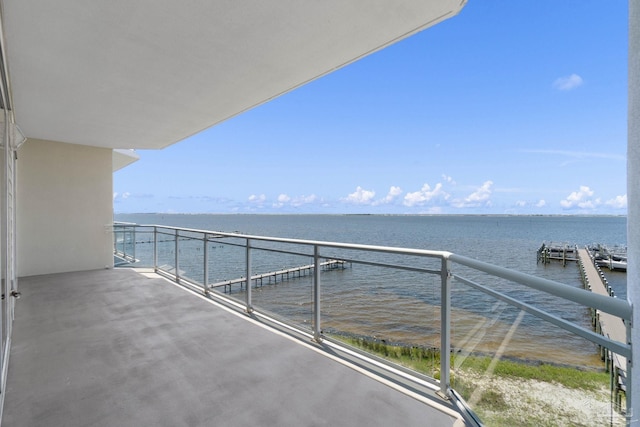 balcony featuring a water view