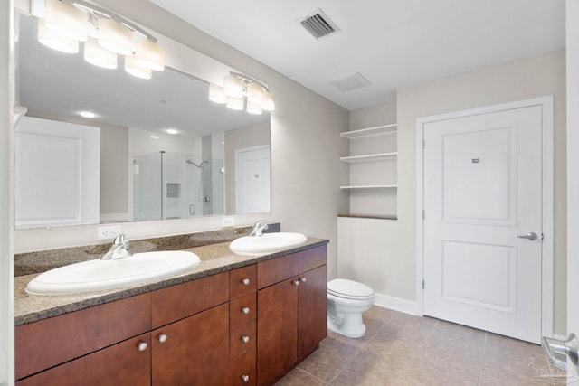 bathroom with tile patterned flooring, vanity, toilet, and a shower with door