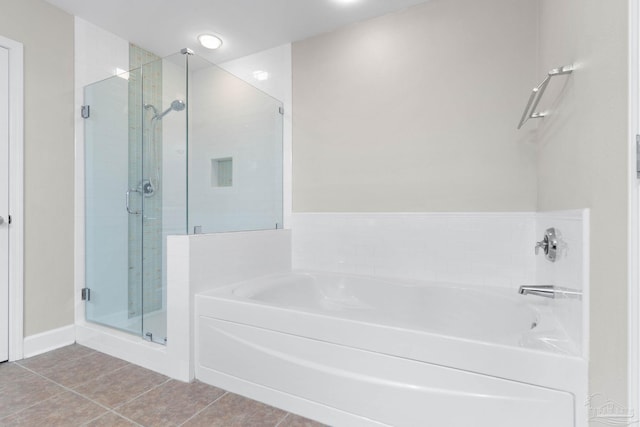 bathroom featuring shower with separate bathtub and tile patterned floors