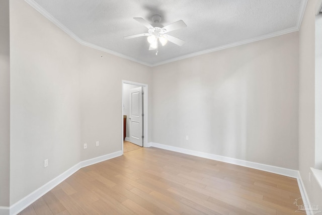 spare room featuring a textured ceiling, light hardwood / wood-style flooring, ceiling fan, and crown molding