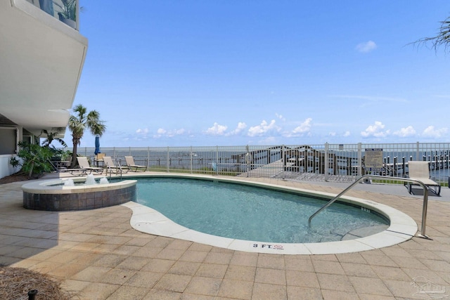 view of swimming pool featuring a patio area