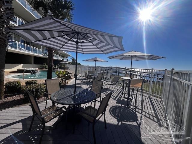 deck with a fenced in pool