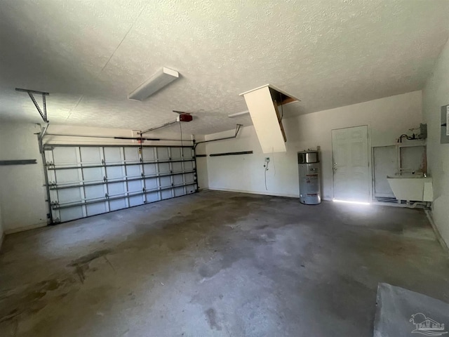 garage featuring a garage door opener, water heater, and sink