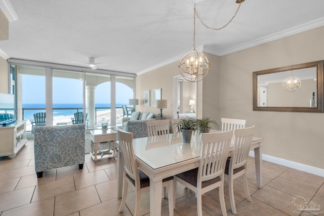 dining space featuring a water view, a textured ceiling, light tile patterned floors, ornamental molding, and expansive windows