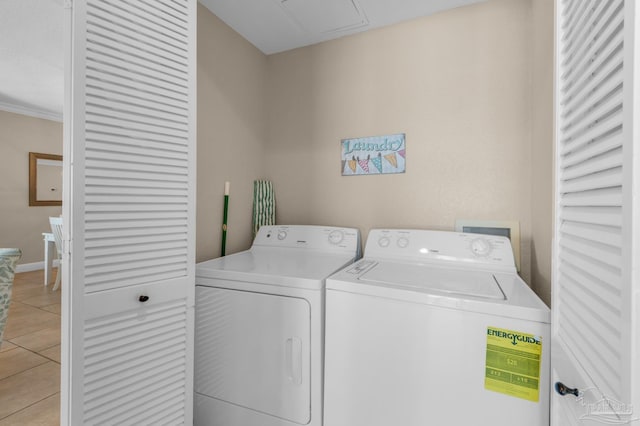 washroom featuring separate washer and dryer and light tile patterned floors