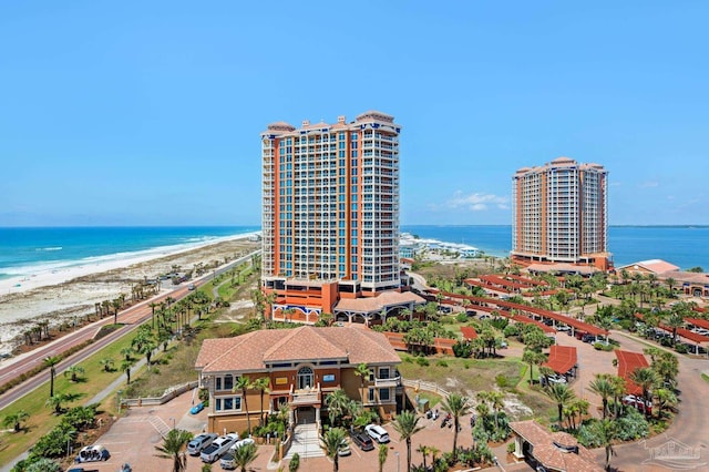 bird's eye view featuring a view of the beach and a water view