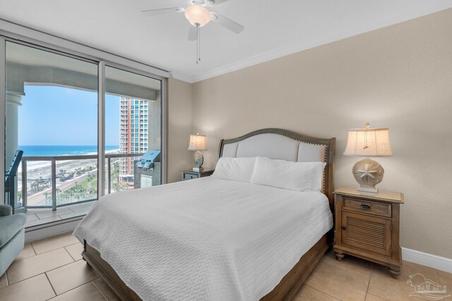 tiled bedroom with a water view, ceiling fan, and baseboard heating