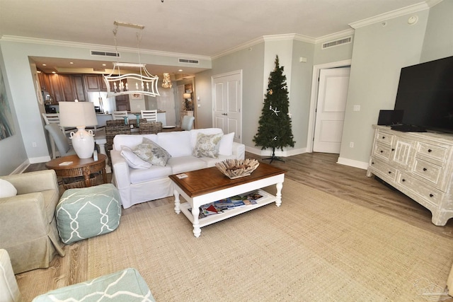 645 Lost Key Dr Unit 406D, Perdido Key, FL 32507 - living area featuring visible vents, baseboards, and wood finished floors