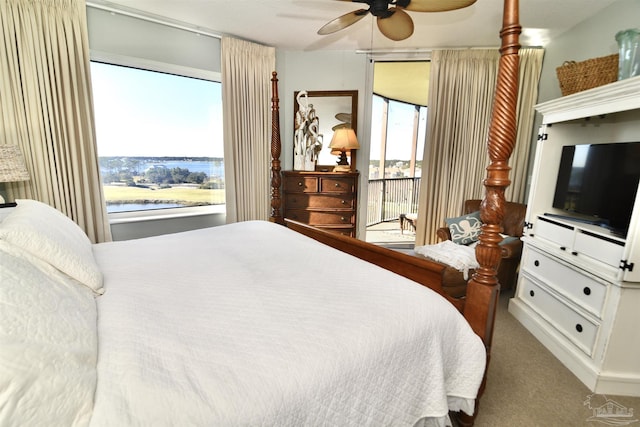 645 Lost Key Dr Unit 406D, Perdido Key, FL 32507 - carpeted bedroom with access to outside, ceiling fan, and a water view