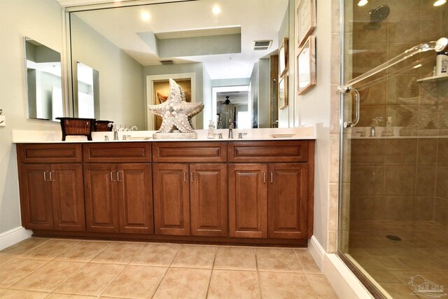 645 Lost Key Dr Unit 406D, Perdido Key, FL 32507 - bathroom featuring a shower stall, tile patterned flooring, a sink, and visible vents