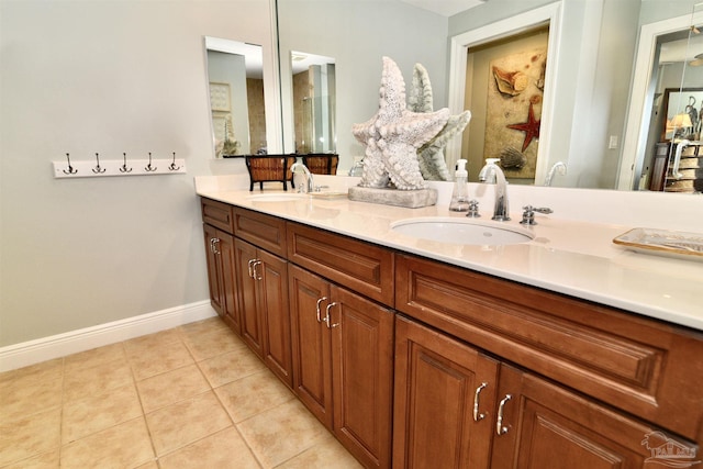 645 Lost Key Dr Unit 406D, Perdido Key, FL 32507 - full bath featuring double vanity, tile patterned flooring, baseboards, and a sink