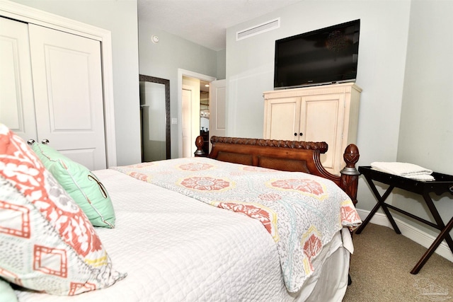 645 Lost Key Dr Unit 406D, Perdido Key, FL 32507 - bedroom with a closet, carpet, visible vents, and baseboards