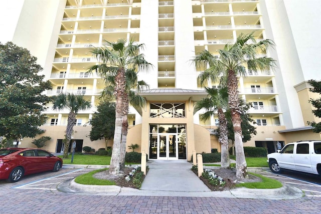 645 Lost Key Dr Unit 406D, Perdido Key, FL 32507 - view of building exterior featuring uncovered parking
