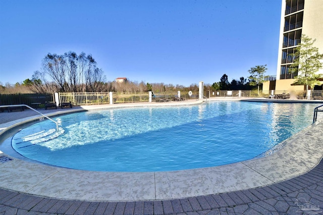 645 Lost Key Dr Unit 406D, Perdido Key, FL 32507 - community pool with a patio area and fence