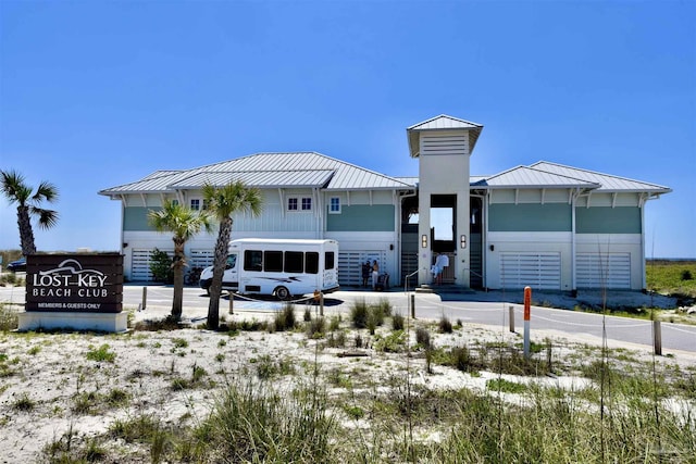 645 Lost Key Dr Unit 406D, Perdido Key, FL 32507 - view of front facade featuring metal roof and a standing seam roof