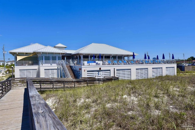 645 Lost Key Dr Unit 406D, Perdido Key, FL 32507 - rear view of property with metal roof and stairs