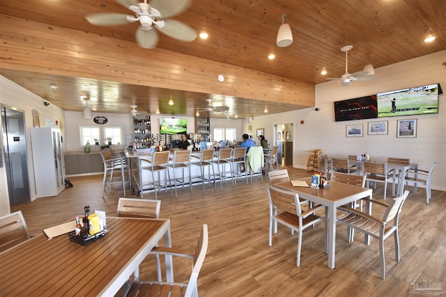 645 Lost Key Dr Unit 406D, Perdido Key, FL 32507 - dining room featuring a wealth of natural light, wood ceiling, wood finished floors, and ceiling fan