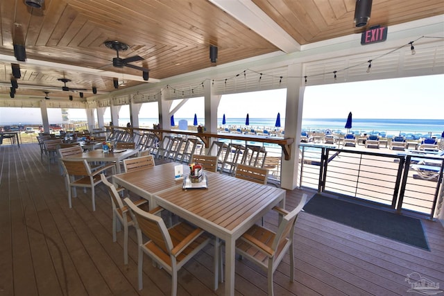 645 Lost Key Dr Unit 406D, Perdido Key, FL 32507 - deck featuring a water view, outdoor dining space, and ceiling fan