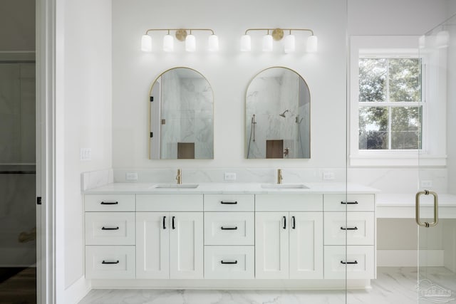 bathroom featuring vanity and a shower with shower door