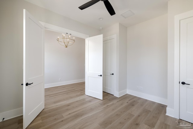 unfurnished room with ceiling fan and light hardwood / wood-style floors