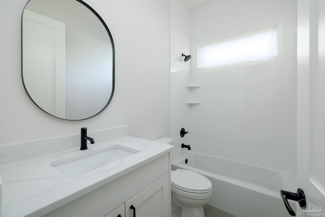 full bathroom with tiled shower / bath combo, vanity, and toilet