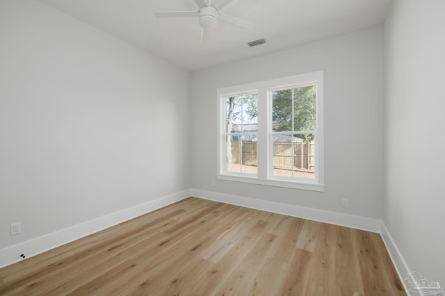 spare room with ceiling fan and light hardwood / wood-style flooring