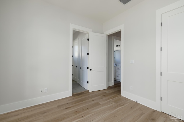 unfurnished bedroom featuring light hardwood / wood-style floors