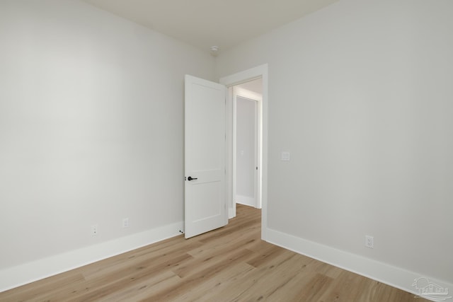 spare room with light hardwood / wood-style floors