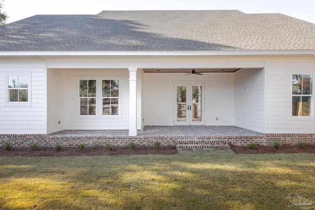 back of property featuring a yard, a patio area, and ceiling fan