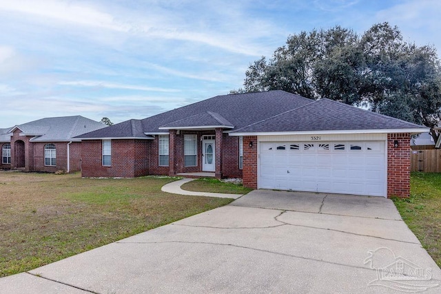 single story home featuring a garage and a front lawn