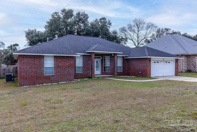 ranch-style home with central air condition unit, a front lawn, and a garage