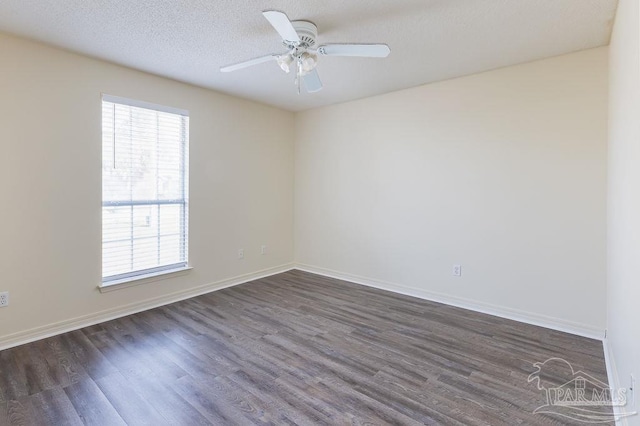 unfurnished room with ceiling fan, dark hardwood / wood-style floors, and a textured ceiling