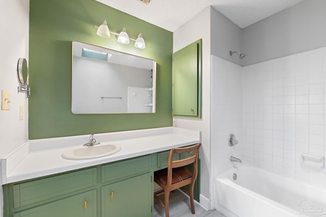 bathroom with vanity, shower / bathing tub combination, a textured ceiling, and hardwood / wood-style flooring