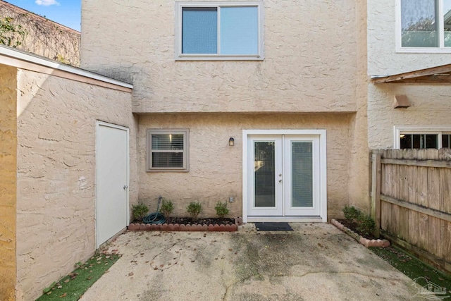 back of house featuring a patio area and french doors