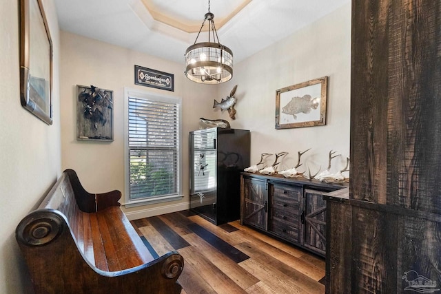 interior space with a chandelier and wood finished floors
