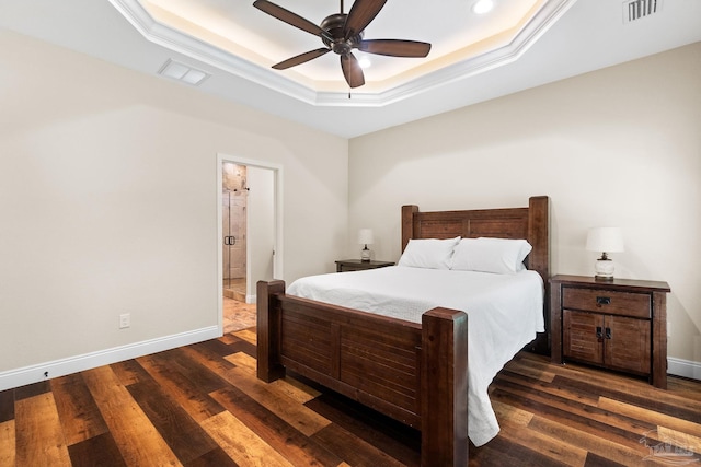 bedroom featuring baseboards, visible vents, a raised ceiling, and dark wood finished floors