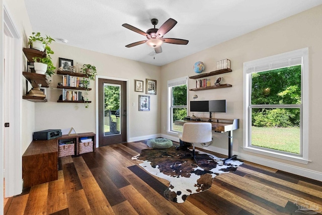 home office featuring a ceiling fan, baseboards, and dark wood-style flooring
