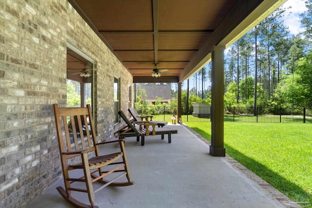 view of patio / terrace featuring ceiling fan and fence