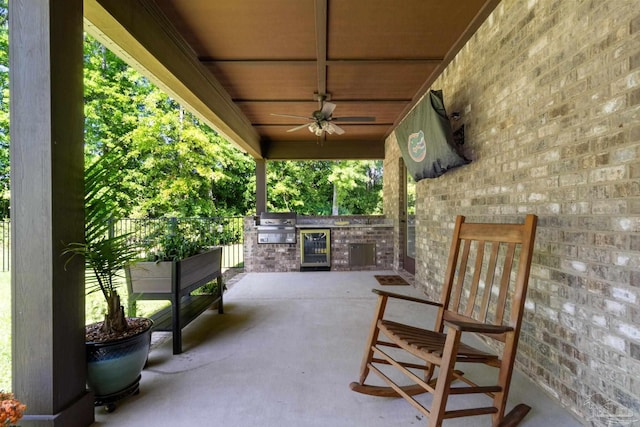 view of patio / terrace with grilling area, beverage cooler, area for grilling, and ceiling fan
