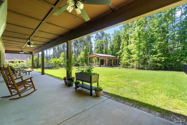 view of patio / terrace with a gazebo, a ceiling fan, and a fenced backyard
