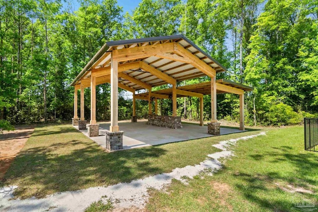 view of property's community with a gazebo, a yard, and a patio