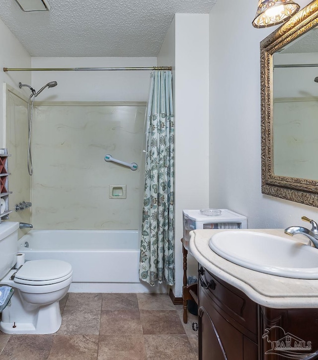 full bathroom with a textured ceiling, vanity, shower / bath combo with shower curtain, and toilet