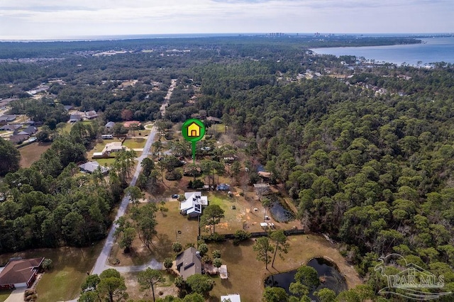 aerial view featuring a water view and a view of trees