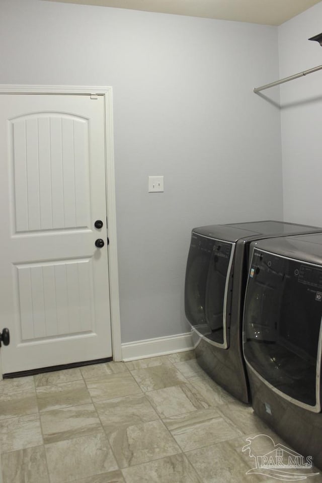 washroom with washing machine and dryer